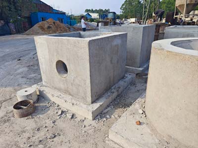 Powder water and admixture dosing for precast concrete