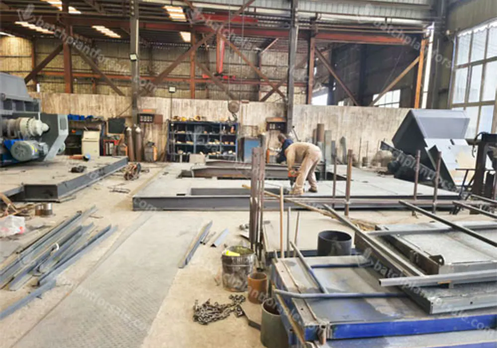 Fabricated batching plant frames arranged inside the AGICO production workshop